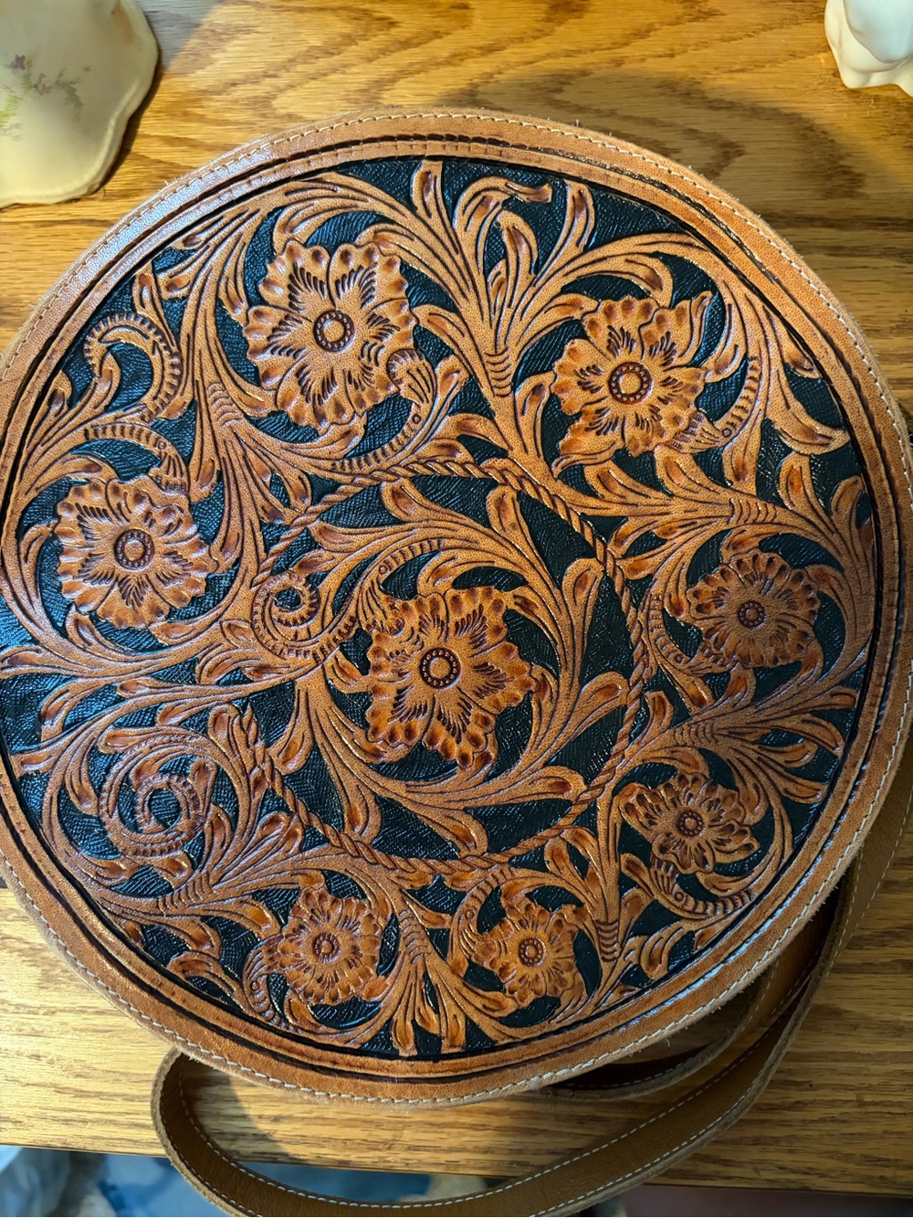 Myra Bag Round Tooled Leather Crossbody in Brown and Black